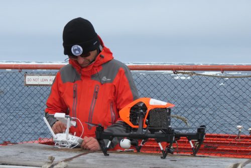 Drone inspection specialist preparing for Antarctic Ice Breaker survey.