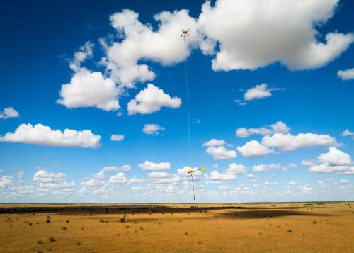 AUAV heavy-lift drone carrying Gap Geophysics SAM receiver during an airborne geophysical survey over a remote Australian mine site